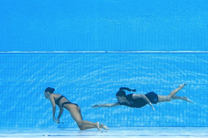 Coach rescues swimmer who fainted inside pool at World Aquatics Championship