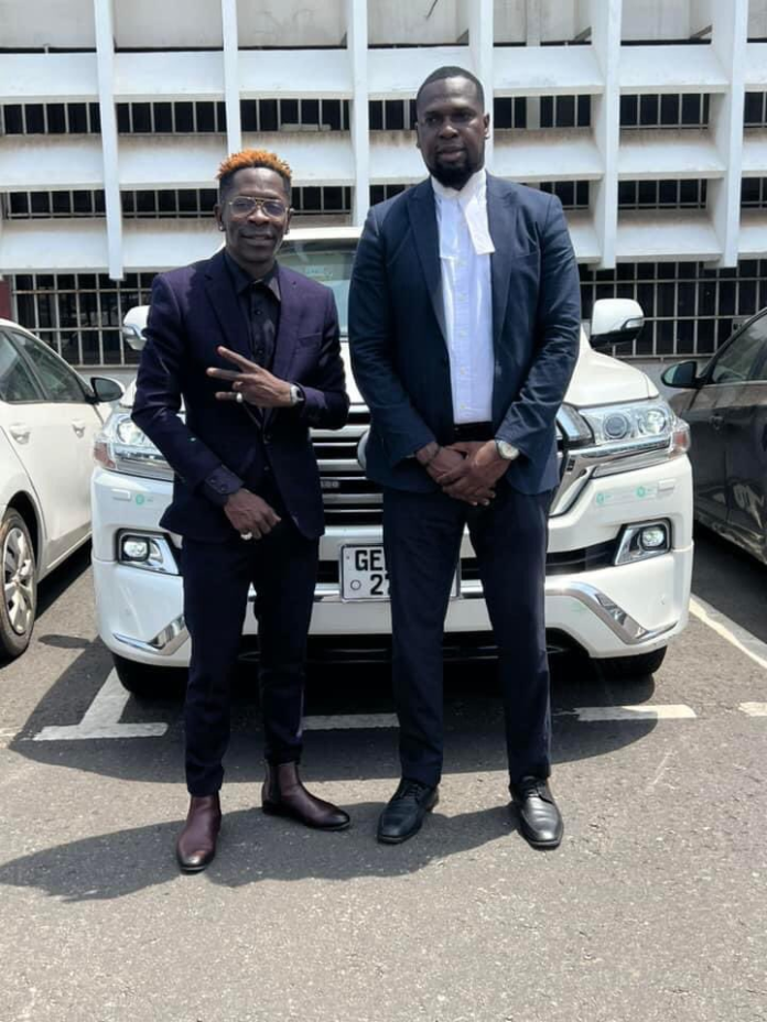 Shatta Wale with his lawyer, Jerry Avenorgbo on his last day in court