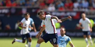Chelsea star Christian Pulisic wearing an orange armband while playing US friendly against Uruguay. Photo by John Dorton/ISI Photos/Getty Images