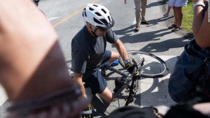 Joe Biden falls off bike