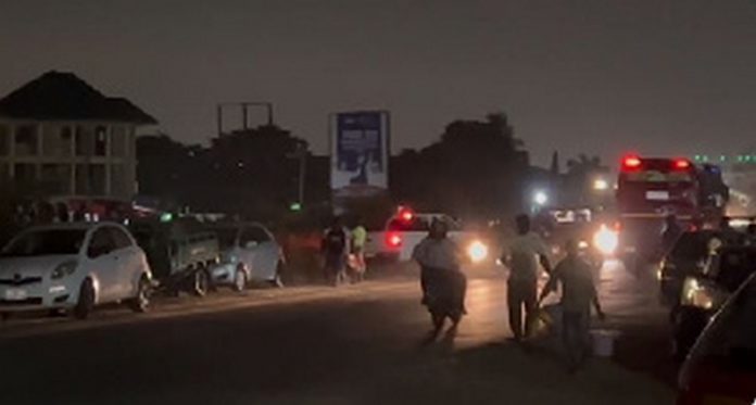 Dozens of residents showed up to the scene with gallons and buckets to siphon the fuel Dozens of residents showed up to the scene with gallons and buckets to siphon the fuel
