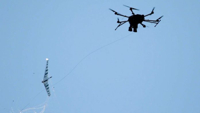 FORTEM TECHNOLOGIES Image caption: A drone interceptor capturing a fixed wing drone FORTEM TECHNOLOGIES Image caption: A drone interceptor capturing a fixed wing drone