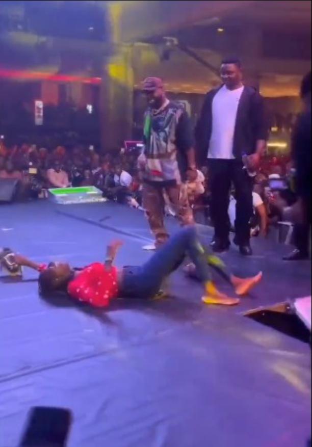 Moment Davido gifted his sneakers, cash to female fan on stage