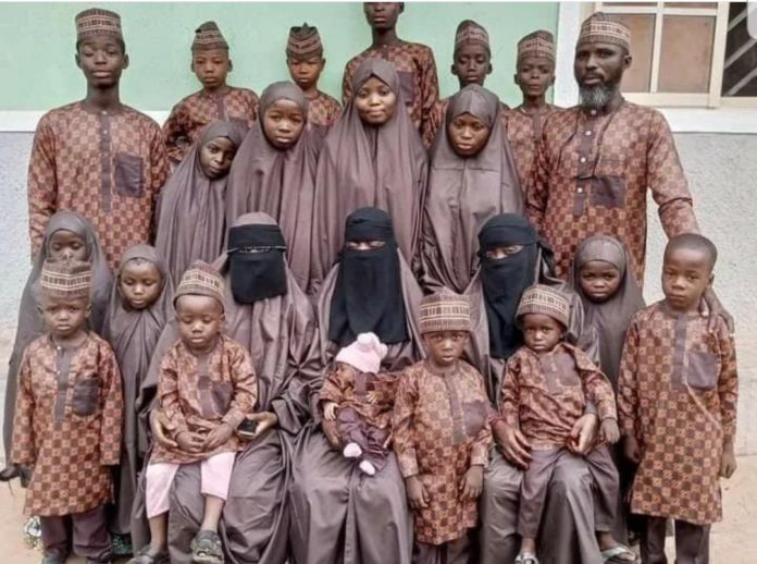Baba Lawal with his wives and children