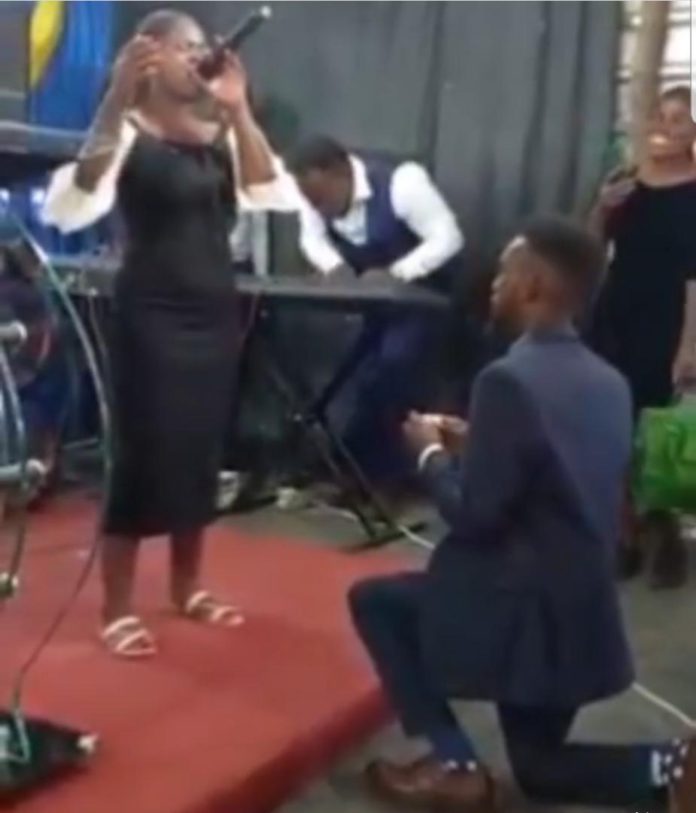 man proposes to his lover as she led worship session in church
