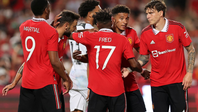 Jadon Sancho celebrates with his team-mates after scoring their first goal against Liverpool Jadon Sancho celebrates with his team-mates after scoring their first goal against Liverpool