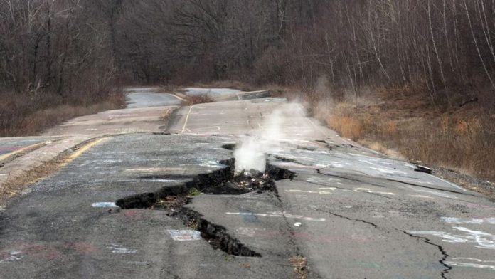 Smoke rises from a large crack in Route 61 caused by the ongoing underground fire in Centralia, Pennsylvania (Image: Don Emmert/AFP via Getty Images) Smoke rises from a large crack in Route 61 caused by the ongoing underground fire in Centralia, Pennsylvania (Image: Don Emmert/AFP via Getty Images)