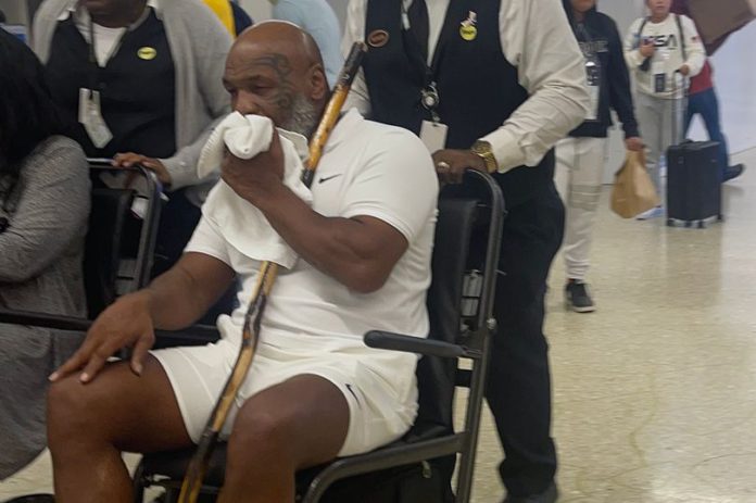 Mike Tyson was pictured in a wheelchair at Miami International Airport Mike Tyson was pictured in a wheelchair at Miami International Airport