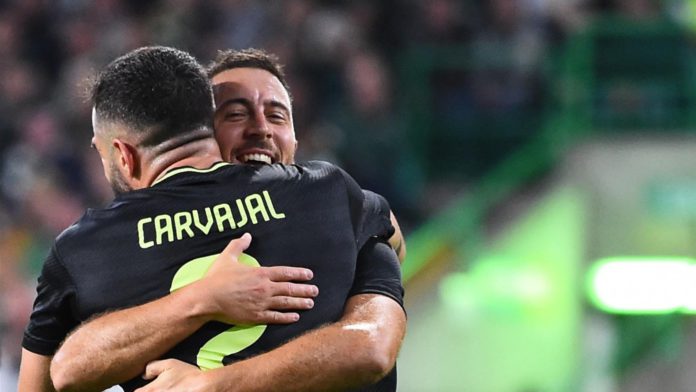 Real Madrid's Belgian forward Eden Hazard (rear R) celebrates with Real Madrid's Spanish defender Dani Carvajal after scoring his team third goal during the UEFA Champions League Group F football match between Celtic and Real Madrid, at the Celtic Park st Image credit: Getty Images Real Madrid's Belgian forward Eden Hazard (rear R) celebrates with Real Madrid's Spanish defender Dani Carvajal after scoring his team third goal during the UEFA Champions League Group F football match between Celtic and Real Madrid, at the Celtic Park st Image credit: Getty Images