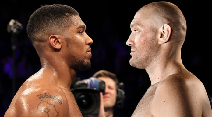 Boxing at Manchester Arena MANCHESTER, ENGLAND - DECEMBER 10: Wladimir Klitschko of Ukraine looks at Anthony Joshua of England (L) following the announcement that the pair will fight at Wembley Stadium in April 2017, at Manchester Arena on December 10, 2016 in Manchester, England. (Photo by Richard Heathcote/Getty Images)