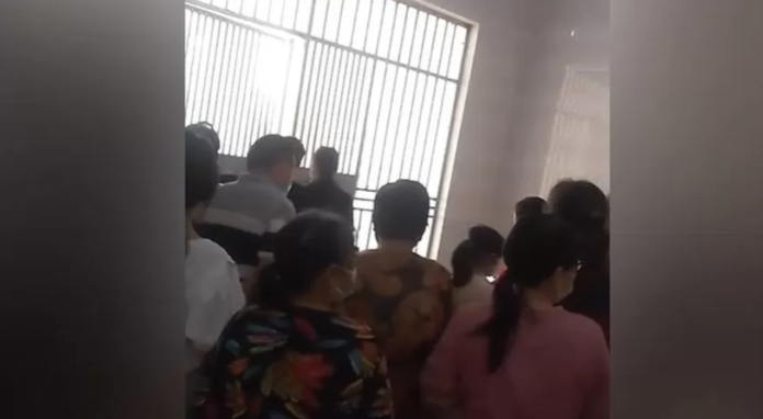 This video showed residents behind gates asking to be let out This video showed residents behind gates asking to be let out