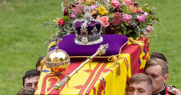 The coffin of Queen Elizabeth II being carried to St George's Chapel carrying the orb, sceptre and the crown all fixed in place (Image: Andy Commins / Daily Mirror) The coffin of Queen Elizabeth II being carried to St George's Chapel carrying the orb, sceptre and the crown all fixed in place (Image: Andy Commins / Daily Mirror)