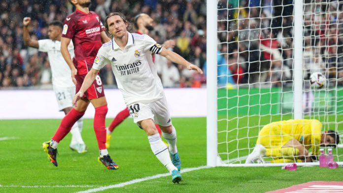 Luka Modric of Real Madrid celebrates after scoring their team's first goal during the LaLiga Santander match between Real Madrid CF and Sevilla FC at Estadio Santiago Bernabeu on October 22, 2022 in Madrid, Spain. (Photo by Angel Martinez/Getty Images) Image credit: Getty Images Luka Modric of Real Madrid celebrates after scoring their team's first goal during the LaLiga Santander match between Real Madrid CF and Sevilla FC at Estadio Santiago Bernabeu on October 22, 2022 in Madrid, Spain. (Photo by Angel Martinez/Getty Images) Image credit: Getty Images