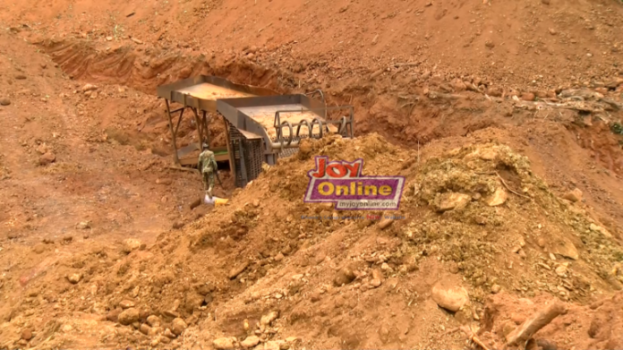 Military-officer-inspecting-mining-equipment-at-Bosomtwe-Range-Forest-Reserve-754x424