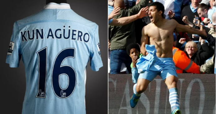 Aguero tore off the shirt, which is stained with both mud and champagne, in celebration Aguero tore off the shirt, which is stained with both mud and champagne, in celebration