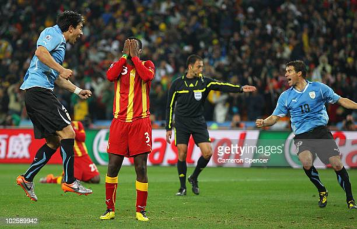 JOHANNESBURG, SOUTH AFRICA - JULY 02: Asamoah Gyan of Ghana reacts as he misses a late penalty kick in extra time to win the match during the 2010 FIFA World Cup South Africa Quarter Final match between Uruguay and Ghana at the Soccer City stadium on July 2, 2010 in Johannesburg, South Africa. (Photo by Cameron Spencer/Getty Images) JOHANNESBURG, SOUTH AFRICA - JULY 02: Asamoah Gyan of Ghana reacts as he misses a late penalty kick in extra time to win the match during the 2010 FIFA World Cup South Africa Quarter Final match between Uruguay and Ghana at the Soccer City stadium on July 2, 2010 in Johannesburg, South Africa. (Photo by Cameron Spencer/Getty Images)