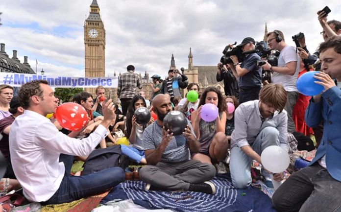 People taking part in a mass inhalation of nitrous oxide outside the Houses of Parliament in protest against the plan to crackdown on legal highs on Aug. 1, 2015 in London, England. Ray Tang/REX Shutterstock People taking part in a mass inhalation of nitrous oxide outside the Houses of Parliament in protest against the plan to crackdown on legal highs on Aug. 1, 2015 in London, England. Ray Tang/REX Shutterstock