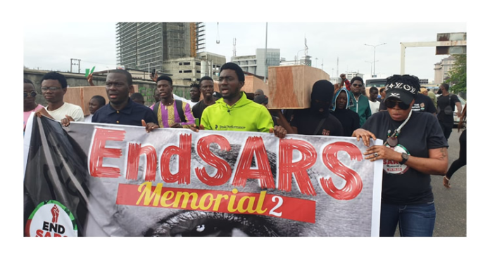 Nigerians carry coffin as they stage walk in memory of Lekki tollgate shooting