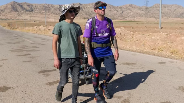 Santiago Sánchez, right, and a friend walk in Iraq's Kurdistan region in August