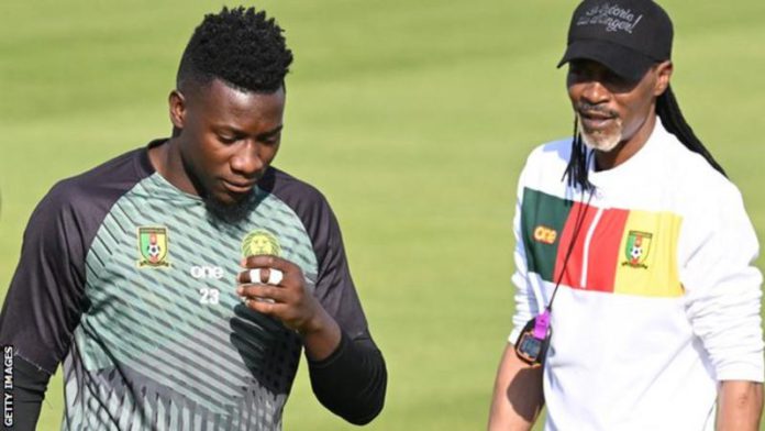 Andre Onana (left) and coach Rigobert Song, pictured during training on Sunday, have fallen out in an apparent row over tactics Andre Onana (left) and coach Rigobert Song, pictured during training on Sunday, have fallen out in an apparent row over tactics