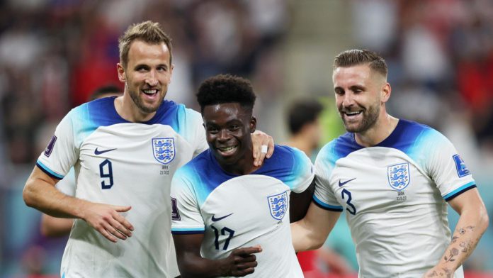 Bukayo Saka of England celebrates with teammates Harry Kane and Luke Shaw after scoring their team's fourth goal during the FIFA World Cup Qatar 2022 Group B match between England and IR Iran Image credit: Getty Images Bukayo Saka of England celebrates with teammates Harry Kane and Luke Shaw after scoring their team's fourth goal during the FIFA World Cup Qatar 2022 Group B match between England and IR Iran Image credit: Getty Images