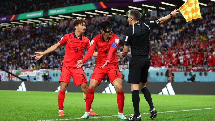 Heungmin Son (C) and Jinsu Kim of Korea Republic argue a call with match officials during the FIFA World Cup Qatar 2022 Group H match between Uruguay and Korea Republic at Education City Stadium Image credit: Getty Images Heungmin Son (C) and Jinsu Kim of Korea Republic argue a call with match officials during the FIFA World Cup Qatar 2022 Group H match between Uruguay and Korea Republic at Education City Stadium Image credit: Getty Images