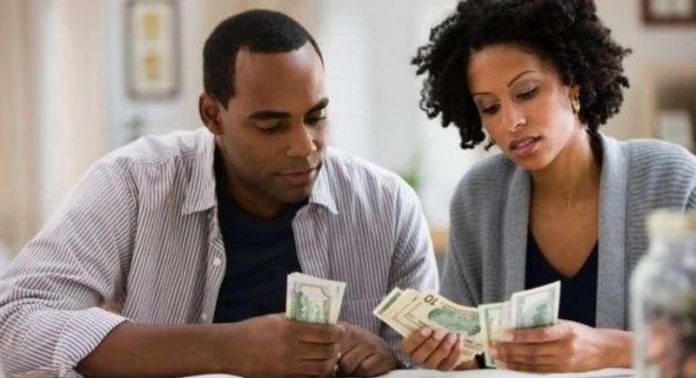 Couple counting money Couple counting money