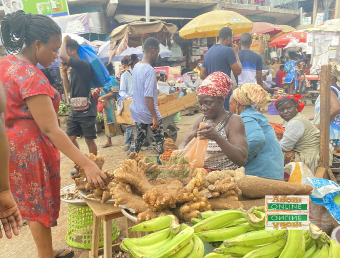 Makola market, Accra: Woman buying foodstuffs on a partly cloudy day | photo taken by Adomonline's Dennis K. Adu Makola market, Accra: Woman buying yams on a partly cloudy day | photo taken by Adomonline's Dennis K. Adu
