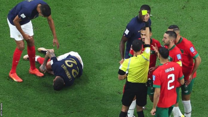 Referee Cesar Ramos booked Sofiane Boufal following a challenge by Theo Hernandez, which Morocco thought should have been a penalty Referee Cesar Ramos booked Sofiane Boufal following a challenge by Theo Hernandez, which Morocco thought should have been a penalty