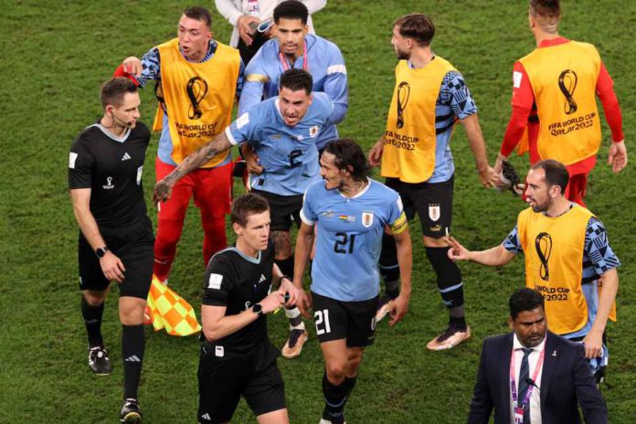 FIFA World Cup Qatar 2022 - Group H - Ghana v Uruguay - Al Janoub Stadium, Al Wakrah, Qatar - December 2, 2022 Uruguay's Jose Maria Gimenez and Edinson Cavani remonstrate with referee Daniel Siebert after the match REUTERS/John Sibley FIFA World Cup Qatar 2022 - Group H - Ghana v Uruguay - Al Janoub Stadium, Al Wakrah, Qatar - December 2, 2022 Uruguay's Jose Maria Gimenez and Edinson Cavani remonstrate with referee Daniel Siebert after the match REUTERS/John Sibley