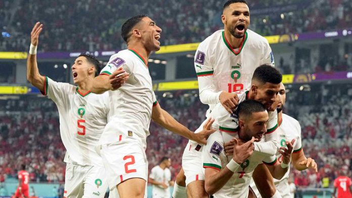 Morocco's Hakim Ziyech is mobbed after scoring the opening goal Morocco's Hakim Ziyech is mobbed after scoring the opening goal