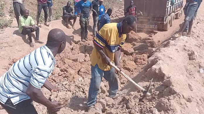 Nkwanta drivers unite to fix deathtrap road with boulders
