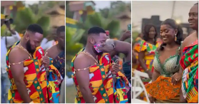 Handsome Groom In Rich Kente Almost Cries After Seeing Bride Photo Source: wedwithkingmcb on TikTok Handsome Groom In Rich Kente Almost Cries After Seeing Bride Photo Source: wedwithkingmcb on TikTok