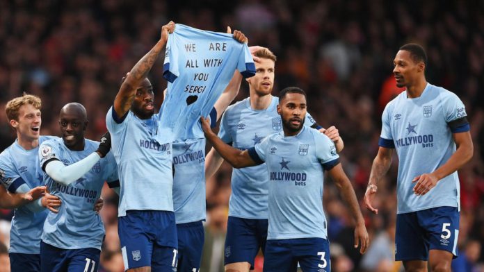 Ivan Toney of Brentford and teammates hold a shirt for former teammate Sergi Canos after scoring the team's first goal during the Premier League match between Arsenal FC and Brentford FC at Emirates Stadium on February 11, 2023 in London, England. Image credit: Getty Images Ivan Toney of Brentford and teammates hold a shirt for former teammate Sergi Canos after scoring the team's first goal during the Premier League match between Arsenal FC and Brentford FC at Emirates Stadium on February 11, 2023 in London, England. Image credit: Getty Images
