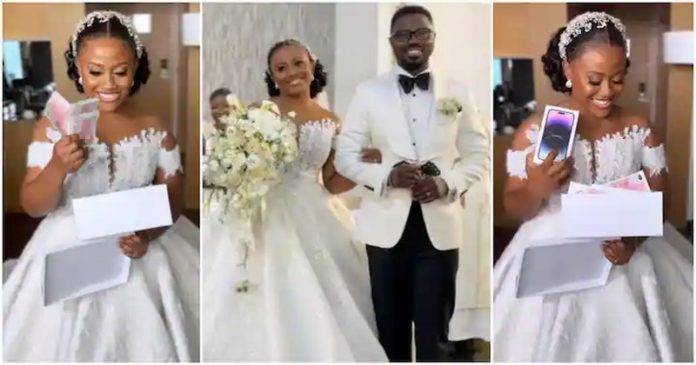 Gorgeous Ghanaian bride receives €10,000, iPhone 14, and Jimmy Choo heels. Photo source: live_weddings_with_kwaku. Gorgeous Ghanaian bride receives €10,000, iPhone 14, and Jimmy Choo heels. Photo source: live_weddings_with_kwaku.