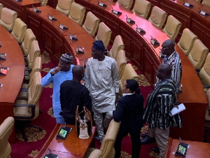 Former Minority leader, Haruna Iddrisu (in brown Khaftan) interacting with colleagues Former Minority leader, Haruna Iddrisu (in brown Khaftan) interacting with colleagues