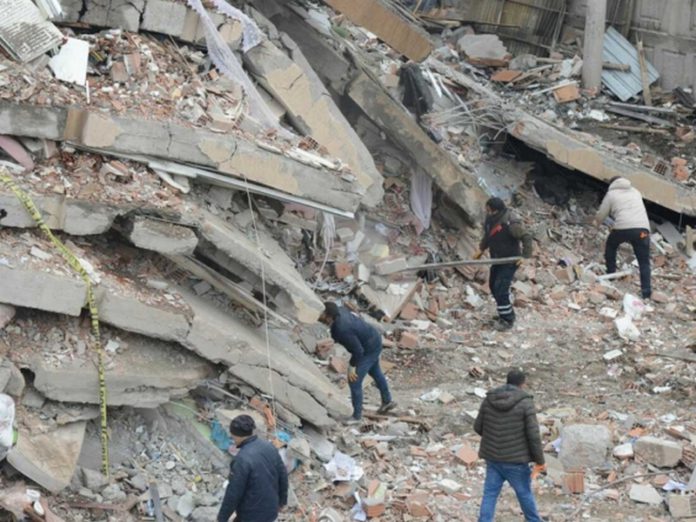 Rescue workers and volunteers conduct search and rescue operations in the rubble of a collasped building, in Diyarbakir on February 6, 2023, after a 7.8-magnitude earthquake struck the country's south-east. - The combined death toll has risen to over 1,900 for Turkey and Syria after the region's strongest quake in nearly a century. Turkey's emergency services said at least 1,121 people died in the earthquake, with another 783 confirmed fatalities in Syria. (Photo by ILYAS AKENGIN / AFP) (Photo by ILYAS AKENGIN/AFP via Getty Images) Rescue workers and volunteers conduct search and rescue operations in the rubble of a collasped building, in Diyarbakir on February 6, 2023, after a 7.8-magnitude earthquake struck the country's south-east. - The combined death toll has risen to over 1,900 for Turkey and Syria after the region's strongest quake in nearly a century. Turkey's emergency services said at least 1,121 people died in the earthquake, with another 783 confirmed fatalities in Syria. (Photo by ILYAS AKENGIN / AFP) (Photo by ILYAS AKENGIN/AFP via Getty Images)