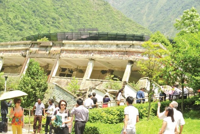 A collapsed building of the Junior High School at Yingxiu Town is now a memorial site A collapsed building of the Junior High School at Yingxiu Town is now a memorial site