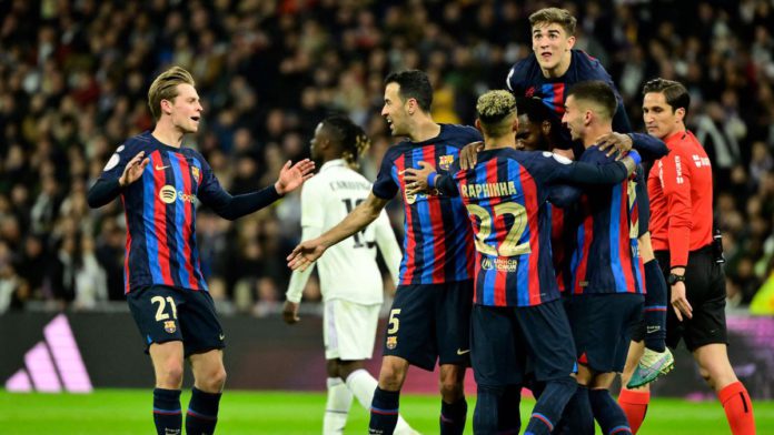 Barcelona's Ivorian midfielder Franck Kessie (C) celebrates with teammates after scoring his team's first goal during the Copa del Rey (King's Cup) semi final first leg football match between Real Madrid CF and FC Barcelona at the Santiago Bernabeu stadiu Image credit: Getty Images Barcelona's Ivorian midfielder Franck Kessie (C) celebrates with teammates after scoring his team's first goal during the Copa del Rey (King's Cup) semi final first leg football match between Real Madrid CF and FC Barcelona at the Santiago Bernabeu stadiu Image credit: Getty Images