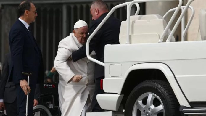 Pope Francis was helped into the popemobile after his weekly general audience on Wednesday