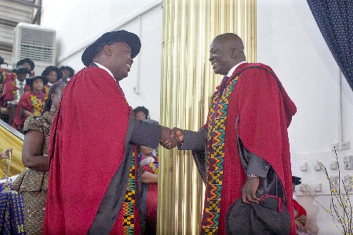 Prof. Robert Darko Osei (left), Dean, School of Graduate Studies, University of Ghana, congratulating Dr Bryan Acheampong, former Minister of State for National Security and Agric Minister designate, during the graduation ceremony. Picture: Maxwell Ocloo Prof. Robert Darko Osei (left), Dean, School of Graduate Studies, University of Ghana, congratulating Dr Bryan Acheampong, former Minister of State for National Security and Agric Minister designate, during the graduation ceremony. Picture: Maxwell Ocloo