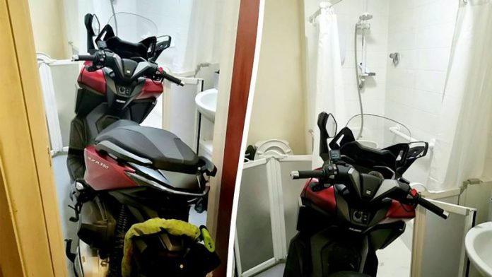 Police discovered a stolen motorbike parked in the bathroom of a residential property (Image: Dudley Police / SWNS) Police discovered a stolen motorbike parked in the bathroom of a residential property (Image: Dudley Police / SWNS)