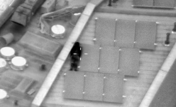 The trickster appeared to be laying against a solar panel on the roof of a building in Wandsworth, London, but they were spotted by police circling above in a helicopter (Image: @NPASLondon/Twitter) The trickster appeared to be laying against a solar panel on the roof of a building in Wandsworth, London, but they were spotted by police circling above in a helicopter (Image: @NPASLondon/Twitter)