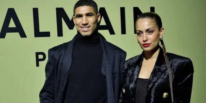 Moroccan and PSG defender Achraf Hakimi (L) and Spanish actress Hiba Abouk pose for a photocall prior to the Balmain Fall-Winter 2022-2023 collection fashion show during the Paris Womenswear Fashion Week, in Paris, on March 2, 2022. (AFP) Moroccan and PSG defender Achraf Hakimi (L) and Spanish actress Hiba Abouk pose for a photocall prior to the Balmain Fall-Winter 2022-2023 collection fashion show during the Paris Womenswear Fashion Week, in Paris, on March 2, 2022. (AFP)