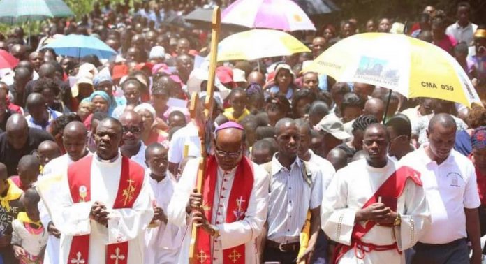 Nyeri Catholic Archbishop Antony Muheria carries a cross as led other faithful in a religious procession to Our Lady of Constanta Cathedral in Nyeri during a past event(Copy) Nyeri Catholic Archbishop Antony Muheria carries a cross as led other faithful in a religious procession to Our Lady of Constanta Cathedral in Nyeri during a past event