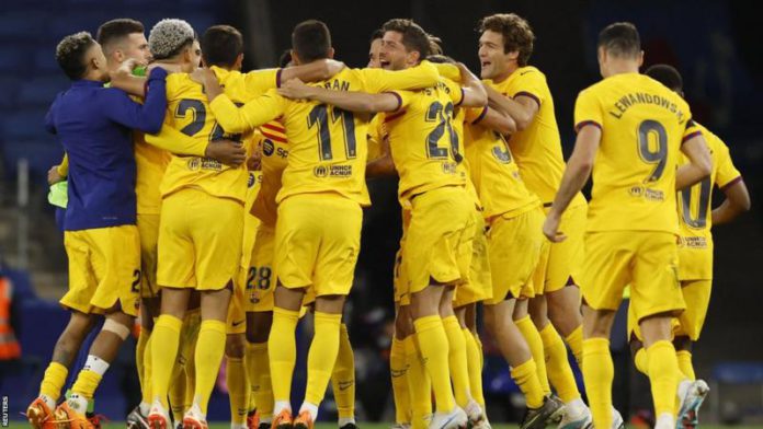 Barcelona's players celebrated on the pitch after claiming their 27th La Liga championship Barcelona's players celebrated on the pitch after claiming their 27th La Liga championship