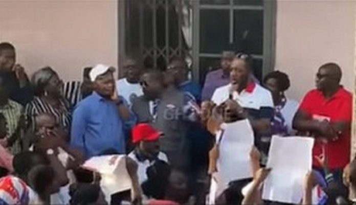 NAPO, with the microphone, addressing residents of Kumawu NAPO, with the microphone, addressing residents of Kumawu