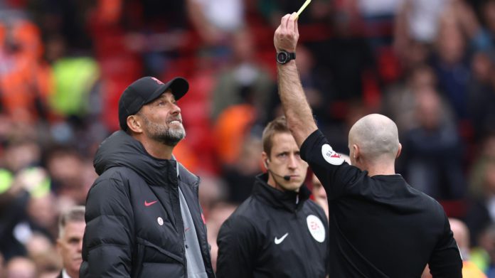 Jurgen-Klopp-receives-a-yellow-card-Liverpool