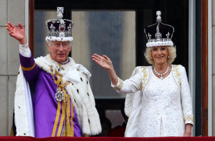 Britain's King Charles and Queen Camilla wave on the Buckingham Palace balcony following their coronation ceremony in London, Britain May 6, 2023. REUTERS/Matthew Childs Britain's King Charles and Queen Camilla wave on the Buckingham Palace balcony following their coronation ceremony in London, Britain May 6, 2023. REUTERS/Matthew Childs