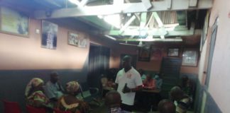 Mr Mettle (Municipal Director), LaDMA, interacting with members of Kone -Adu We Clan to commemorate the Constitution Week Celebration at La